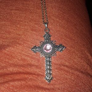 Pink snap cross necklace.